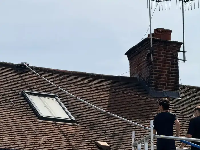 Roof soft wash in progress on a Hertfordshire house