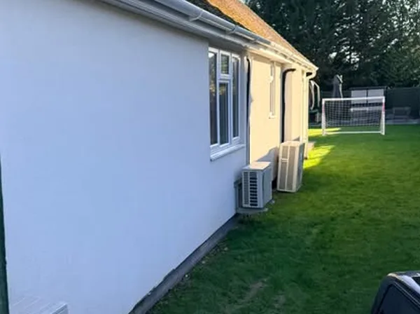 Soft Pressure Herts team pressure washing a driveway